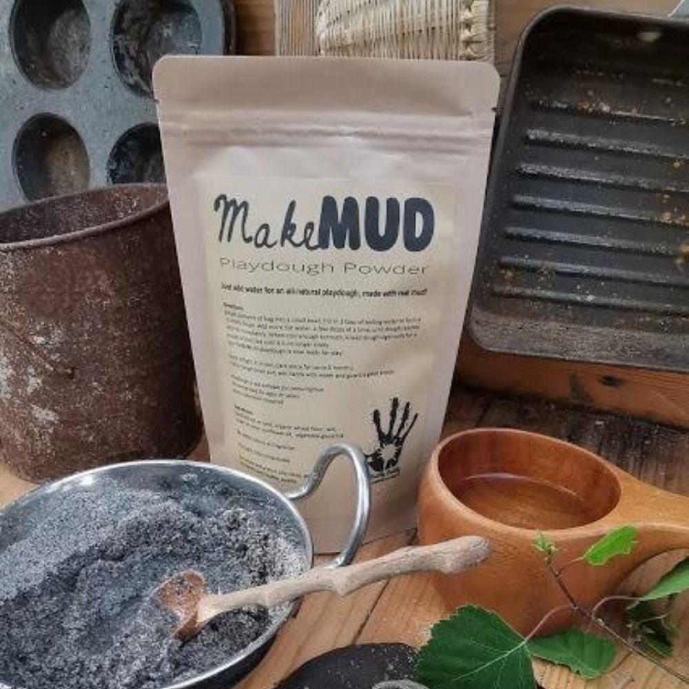 Mud Playdough Powder sachet in a mud kitchen.