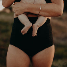 Load image into Gallery viewer, New Mum wearing high waist postpartum underwear holding a newborn baby.