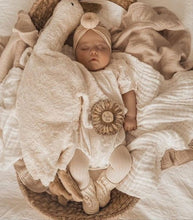 Load image into Gallery viewer, Sleeping newborn baby in coming-home outfit of booties 