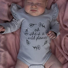 Load image into Gallery viewer, oh-she&#39;s-a-wildflower-onesie-on-a-sleeping-baby-girl