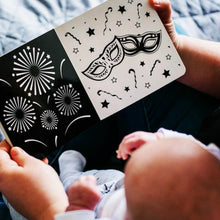 Load image into Gallery viewer, baby being read a book