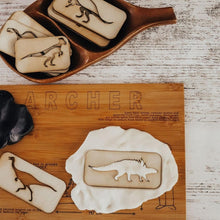Load image into Gallery viewer, wooden-board-and-dish-on-a-table-with-playdough-and-dinosaur-stamps