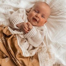 Load image into Gallery viewer, smiling baby laying under a rainbow blanket