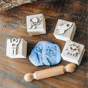 playdough-a-rolling-pin-and-space-playdough-stampers-on-a-table
